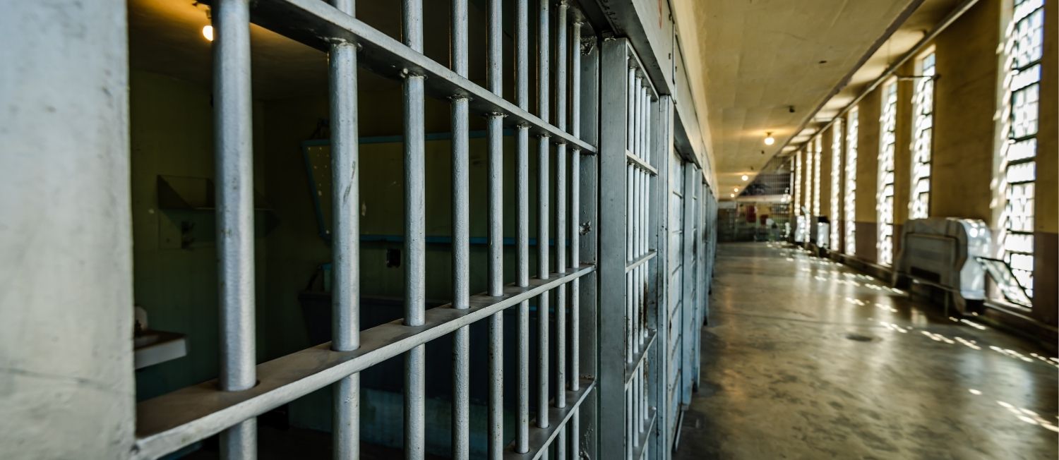 wide angle image of a prison hallway