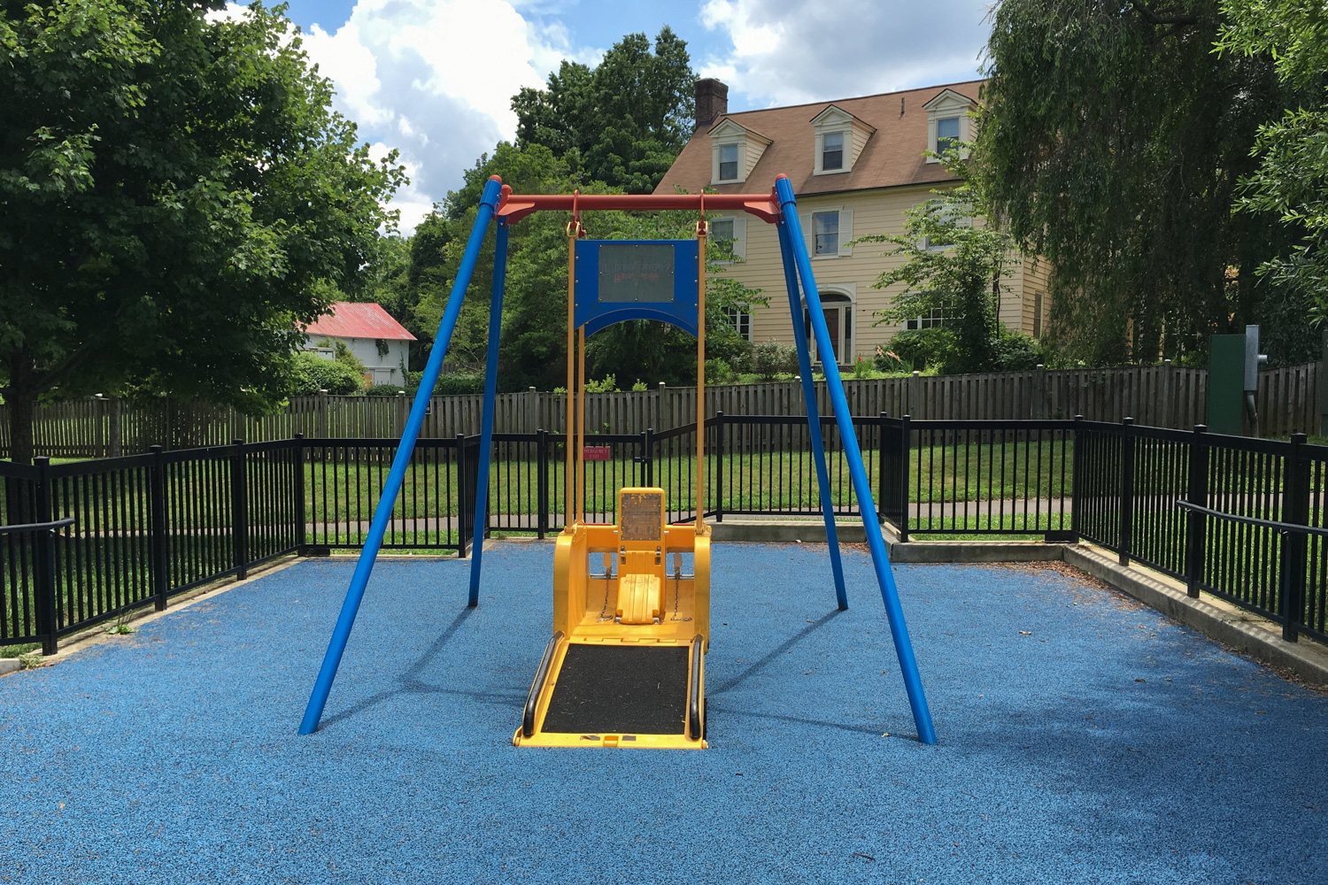 Wheelchair accessible swing at playground. Photo anitrabutler via Pixabay. 